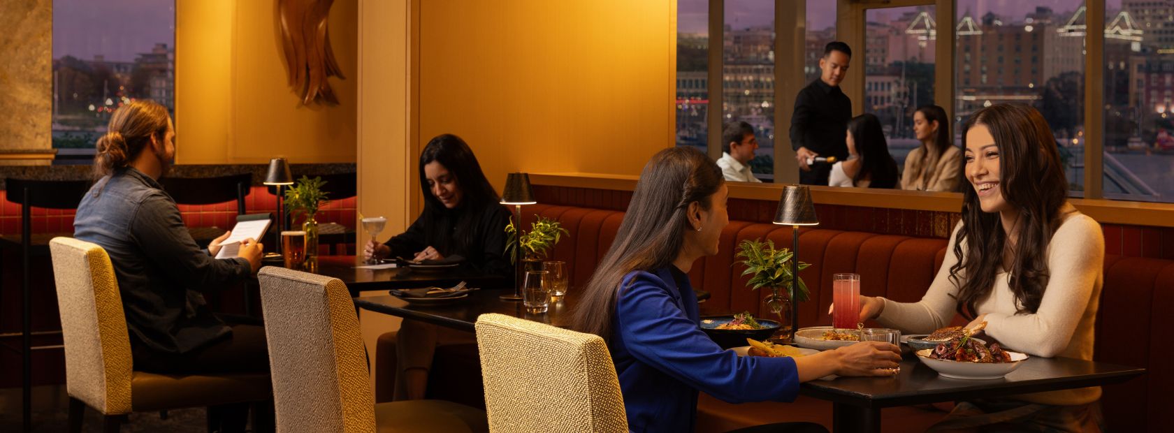 diners in the lounge of Aura Restaurant